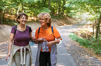 Two women walking in the woods